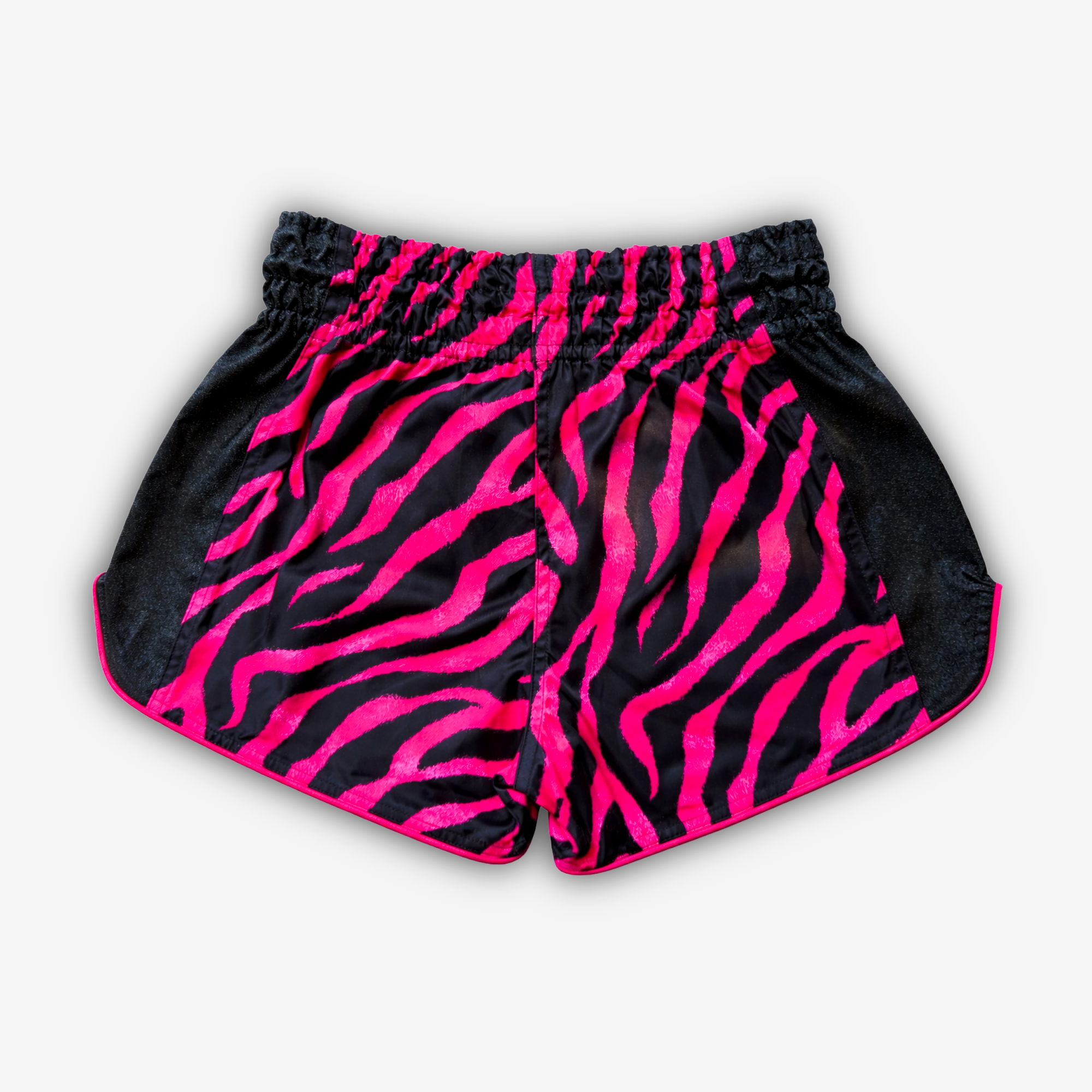Black and Pink Tiger Strip Print, Black Glittery Sides, Golden Glittery Front Logo.
Muay Thai shorts designed for unrestricted movement and reliable performance.

From the Midnight Hunt Collection

KEY FEATURES:
Quick-dry and lightweight
Flexible fabric
Side slits for freedom of movement
Adjustable waistband
Unique sublimation print
Embroidered logo
